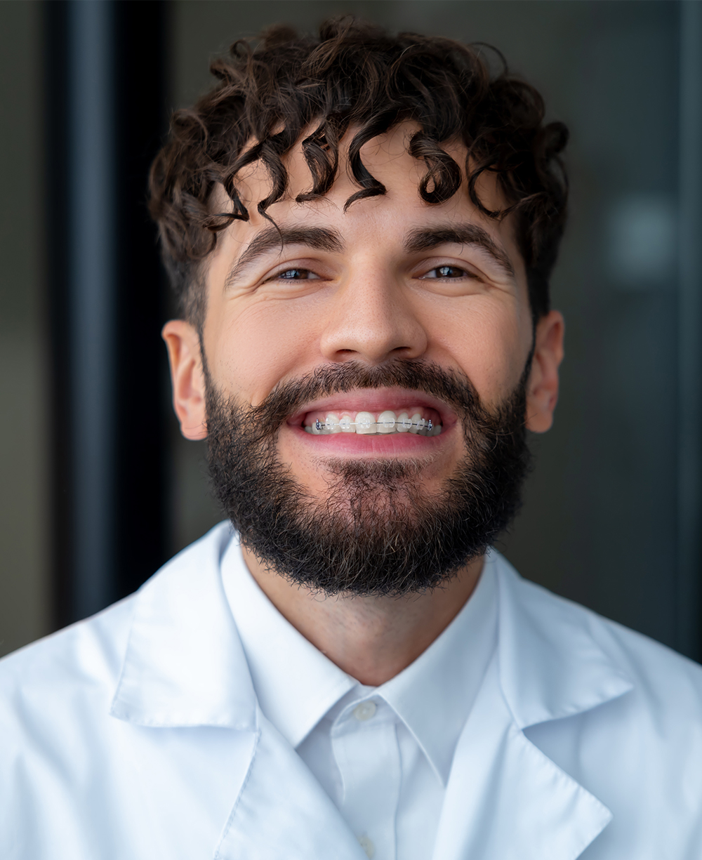Patient smiling with clear braces